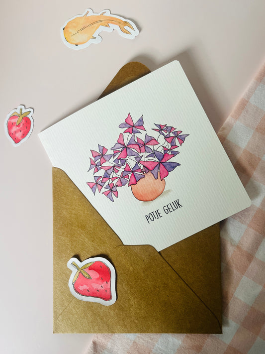 Wenskaart vierkant met een witte achtergrond. En een waterverf illustratie van de plant; oxalis triangularis en de tekst: potje geluk. Ontwerp door Studio Dwarsdenker